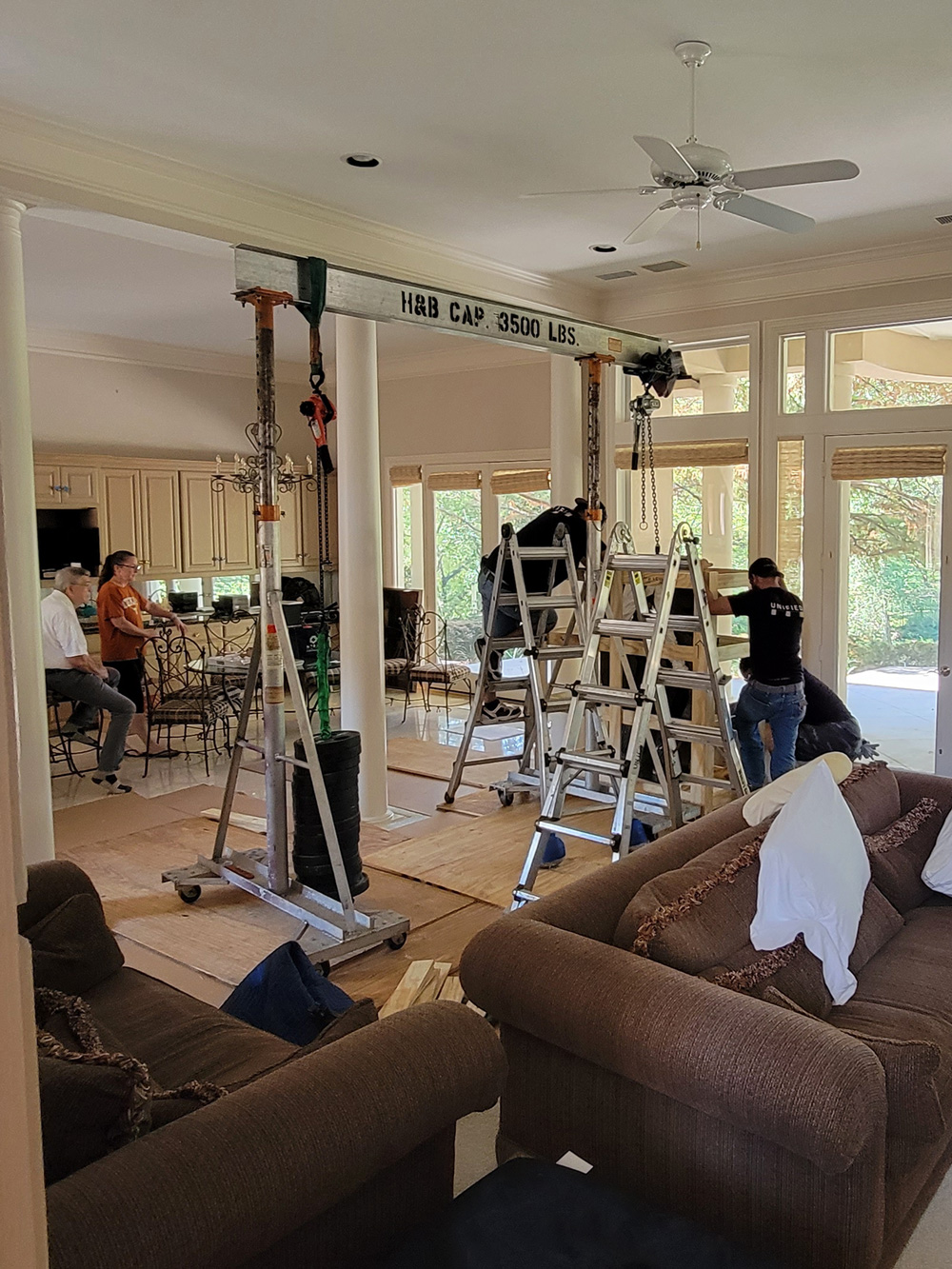 Installation of heavy marble statue in residence